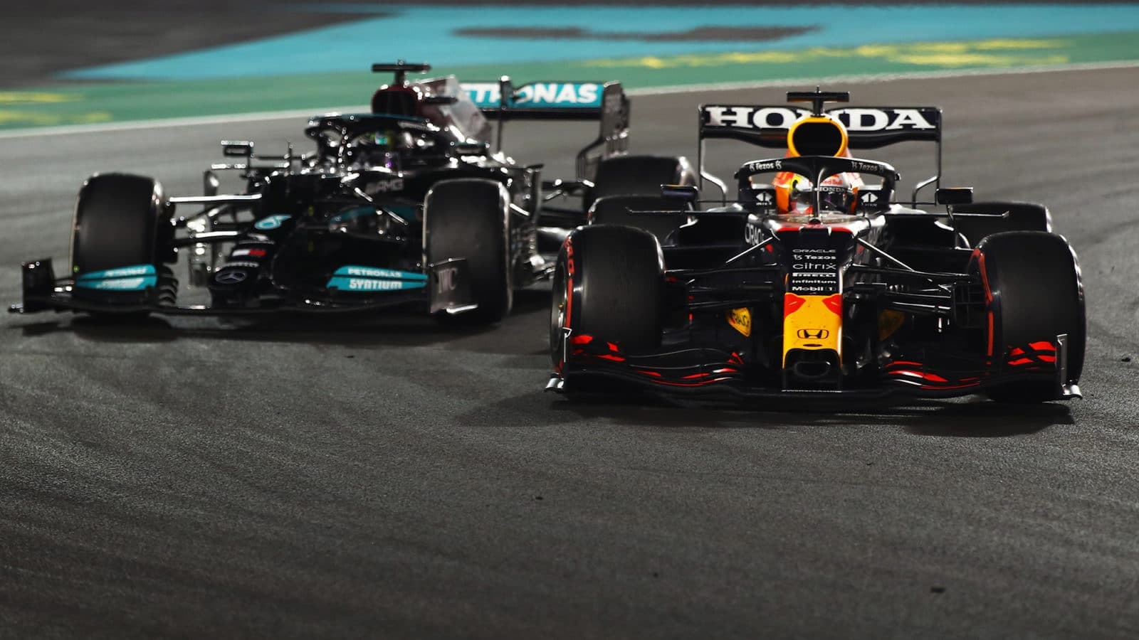 Max Verstappen overtaking Lewis Hamilton in the 2021 Abu Dhabi